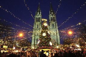 Christmas market and tree at Namesti Miru in Prague, Church of st. Ludmila