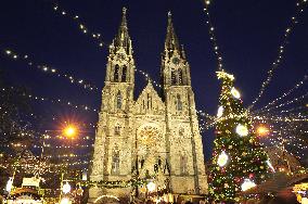 Christmas market and tree at Namesti Miru in Prague, Church of st. Ludmila