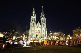 Christmas market and tree at Namesti Miru in Prague, Church of st. Ludmila