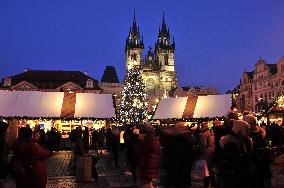 Christmas market and tree at Old Town Square in Prague, Church of Our Lady before Tyn