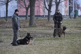 The policemen with dogs guard the surroundings of the court