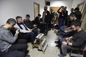 Journalist await in front of the courtroom