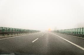 thick, heavy, dense fog, winter, European route E55, D3 motorway, road workers vehicles