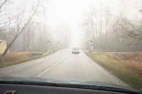 thick, heavy, dense fog, winter, road, railway, level crosssing, cross-roads, white light, gate, boom barrier