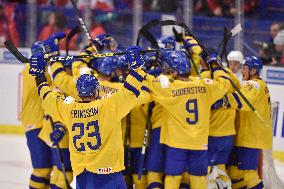 Swedish players celebrate after they won the bronze