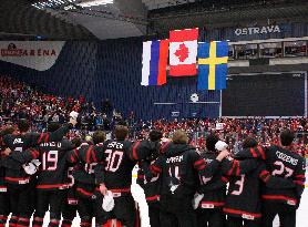 Canadian players follow the national flags of Russia, Canada and Sweden