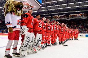 The mascot and team of Hradec line up as they celebrate victory