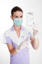 health care, nurse, nursing sister, woman, facecloth, mouth protection, syringe, saline, injection