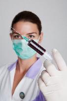 health care, nurse, nursing sister, woman, facecloth, mouth protection, syringe, blood, injection