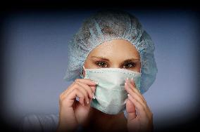 nurse with a medical cap and mask