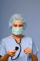 nurse with a medical cap, mask, stethoscope