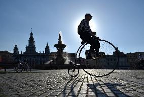 A rider on historic bike on the square of Premysl Otakar II