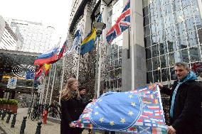 Anti Leaving the European Union campaigners hold EU flags
