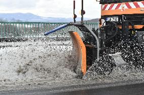 snowplow on a snow covered road