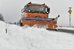 snowplow on a snow covered road