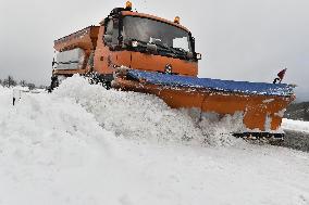 snowplow on a snow covered road