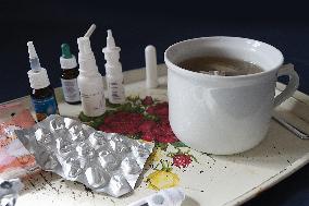 Medicine, pills, thermometer, nose drops, handkerchiefs, tea, flu, cold