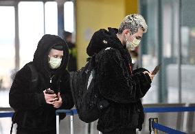 A passenger wearing face mask at the Brno Turany Airport