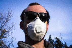 Young man, Valved Dust Mist Respirator FFP1,  Disposable Dust Mask, sun glasses