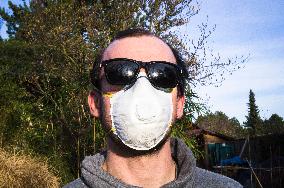 Young man, Valved Dust Mist Respirator FFP1,  Disposable Dust Mask, sun glasses