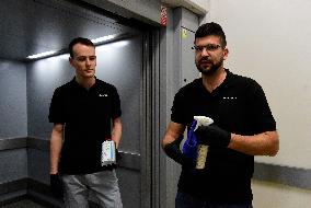 a worker disinfects public interior parts at the Gallery Santovka shopping mall against coronavirus