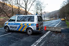 Czech police patrol watch at the closed border crossing Hrensko-Schmilka