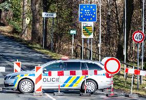 Czech police patrol watch at the closed border crossing Petrovice-Luckendorf