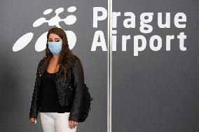 Vaclav Havel Airport Prague, woman, protective medical mask, coronavirus