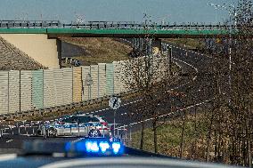 Polish police patrol watch at the closed border crossing Hradek nad Nisou-Porajow