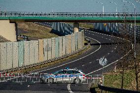 Polish police patrol watch at the closed border crossing Hradek nad Nisou-Porajow