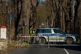 Polish police patrol watch at the closed border crossing Hradek nad Nisou-Porajow