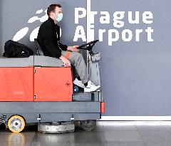 Vaclav Havel Airport Prague, coronavirus, protective medical mask, floor cleaning machine