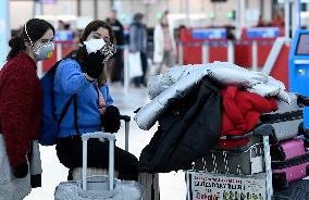Vaclav Havel Airport Prague, coronavirus, protective medical mask, respirator, passengers
