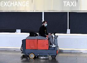 Vaclav Havel Airport Prague, coronavirus, protective medical mask, floor cleaning machine