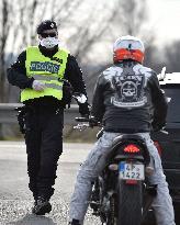 policeman, mask, control, motorbike, driver, at the Bohumin - Chalupki crossing between Poland and the Czech Republic