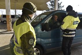 Czech soldiers help police officers guard the Mikulov-Drasenhofen border crossing