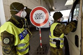 Czech soldiers help police officers guard the Mikulov-Drasenhofen border crossing