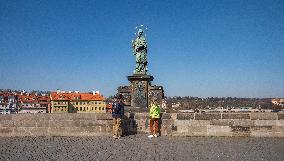 St. John of Nepomuc statue, Charles Bridge, Empty center of Prague, historical center, Prague, city, without tourists, restricted movement of people, travel ban, prevention of infection, Coronavirus, Covid 19