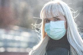 blonde woman with a protection face mask