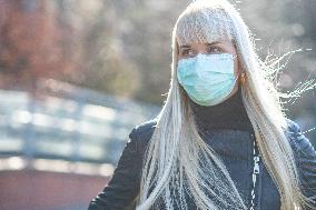 blonde woman with a protection face mask