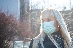 blonde woman with a protection face mask