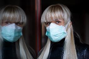 blonde woman with a protection face mask and FFP3 respirator