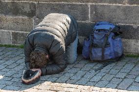 Charles Bridge, beggar, homeless