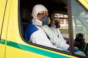 special infectious ambulance, paramedics in a protective suits, paramedic, suit