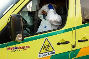 special infectious ambulance, paramedics in a protective suits, paramedic, suit, biological hazard, biohazard