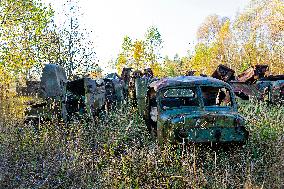 Chernobyl zone, restricted territory, Rasocha a radioactive cemetery of vehicles