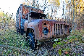 Chernobyl zone, restricted territory, Rasocha a radioactive cemetery of vehicles