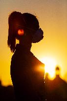 empty Charles Bridge in Prague, girl, face mask, coronavirus