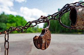 Chernobyl zone, restricted territory, a chain and open padlock