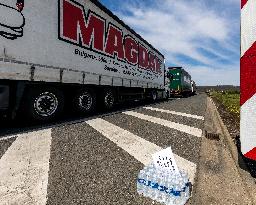 trucks are jammed on the motorway D8 in front of the Czech-German border crossing, bottle of water